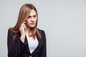 Beautiful smiling business woman talking on the phone