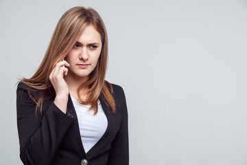 Beautiful smiling business woman talking on the phone