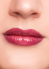 Fototapeta premium Close up portrait of beautiful young woman face, red lips