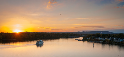 Ottawa Riverboat sunset.  Dusk falls over the city and river as riverboats of tourists enjoy the evening.