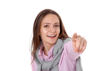 Young woman point finger at you  on white background