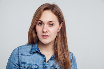 Portrait of a girl in a blue denim dress - isolated on white background