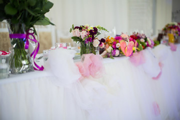 Beautifuly decorated wedding reception table covered with fresh