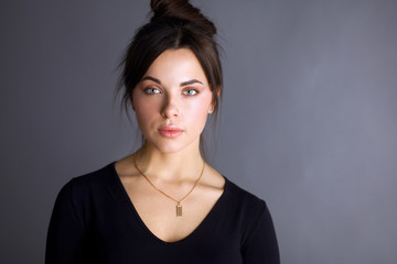 Portrait of an attractive fashionable young brunette woman