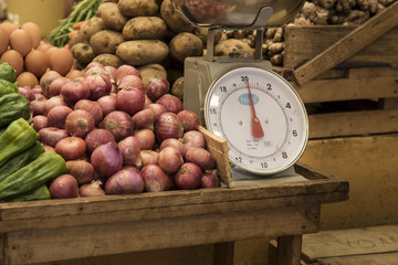 Weighing on a vegetables market 