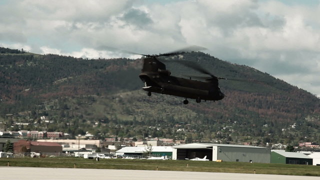 Panning shot following a CH-47 Chinook Helicopter.