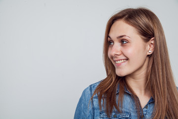 Obraz premium Portrait of a girl in a blue denim dress - isolated on white background