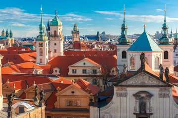 Fotobehang Aerial view over Old Town in Prague with domes of churches, Bell tower of the Old Town Hall, Powder Tower, Czech Republic  © Kavalenkava