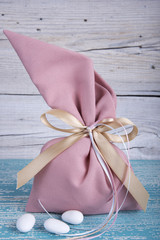 Fabric pouch wedding favor on old wooden table