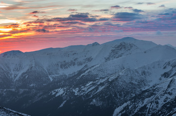 Colorful mountain sunset panorama at winter in Western Tatras