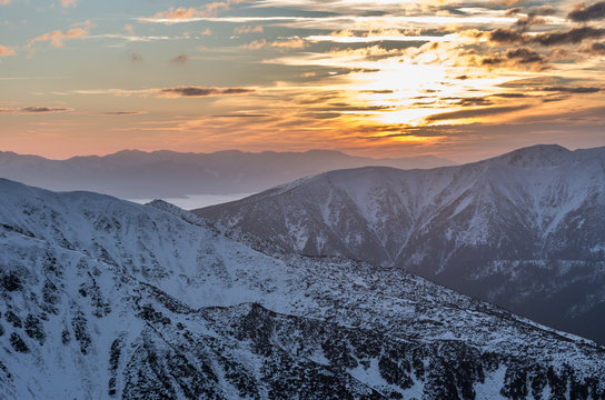 Colorful mountain sunset panorama at winter in Western Tatras
