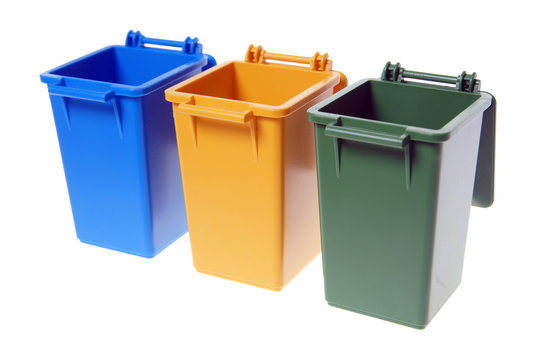 Dustbins / Dustbins in the colors blue, yellow and green isolated over a white background
