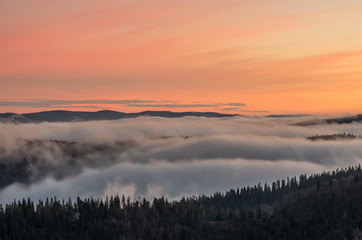 Carpathian mountains in the clouds, sunrise seen from Wysoka mountain in Pieniny, Poland