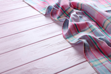 Napkin on pink wooden table, close up