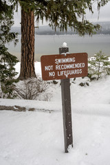Winter Idaho lake with a no swimming sign