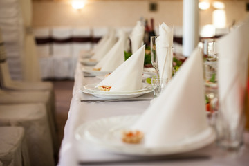 Closeup of fine dinning tableware and silverware catered at wedd