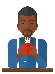 Man sitting with cup of coffee.