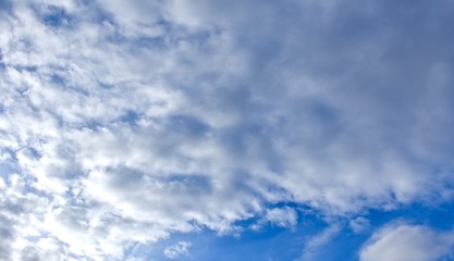 Soft white clouds in a blue sky