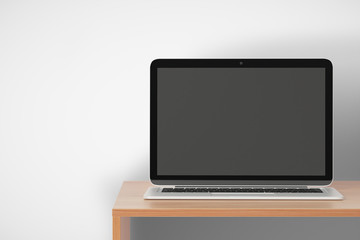 Blank laptop on a wooden shelf, mock up