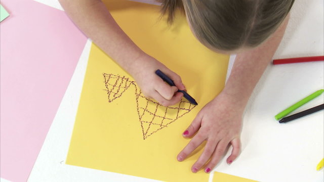 Royalty Free Stock Footage of Close up of a young girl drawing with a crayon.