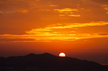 Part sunrise over mountains