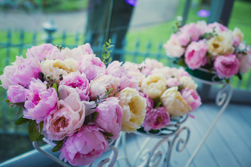 Beautiful wedding interior and table decor, flower decoration with flowers bouquet, with roses, tulips, peonies