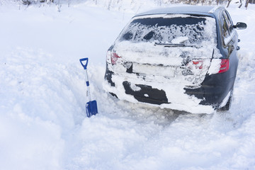 Fototapeta na wymiar Car stuck in snow