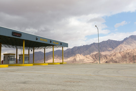 Aqaba, Jordan, 04/11/2015, Aqaba City checkpoint, with rugged mountain backdrop on a cloudy day