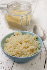 cooked couscous in a  blue  bowl
