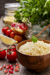 cooked couscous, fresh vegetables for salad