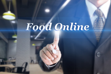 Fototapeta na wymiar A Businessman holding a white sign with the message Food Online. Can bring to the medium of your ad.