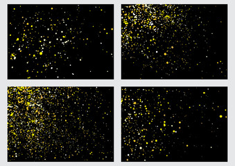 Gold glitter explosion set on black background made of spray paint. Collection of golden festive blow texture of confetti. Golden grunge grainy spray abstract texture of snowflakes. Winter Holiday.