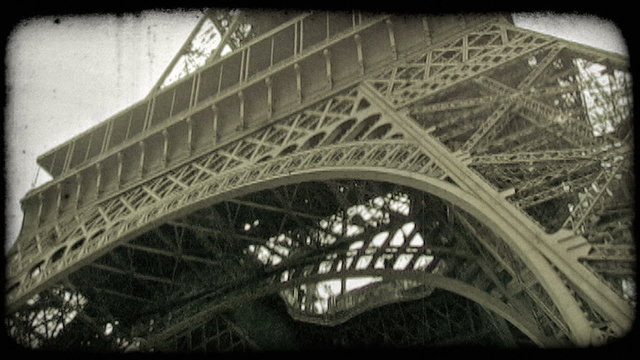 Underneath Eiffel Tower. Vintage stylized video clip.