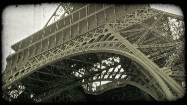 Underneath Eiffel Tower. Vintage stylized video clip.