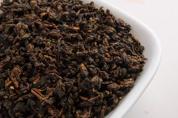 Dry Chinese green tea leaves Ololong isolated