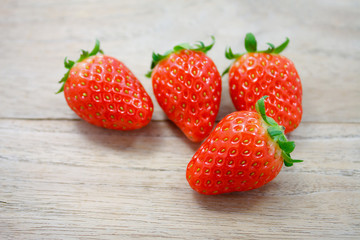 Fresh strawberries on wooden background
