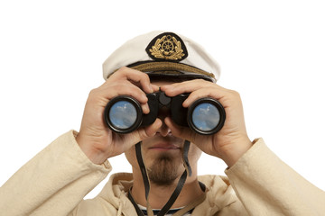 Captain looks through a binoculars