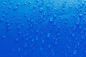 Rain Water droplets on blue fiber