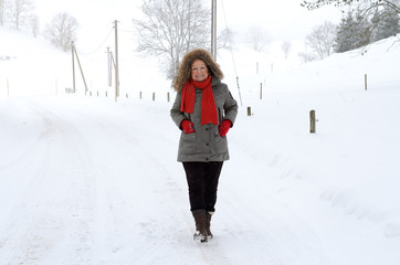 Fototapeta na wymiar Active elderly lady in winter fashion
