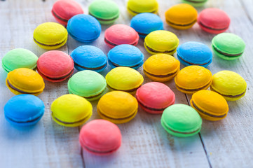 French colorful macarons on wood table