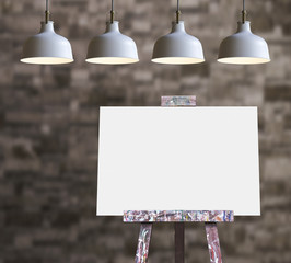 Wooden easel with blank painting canvas in the room