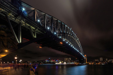Sydney Harbour Bridge on a stormy night.