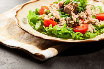 Tasty salad with couscous, tuna and vegetables