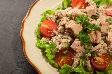 Tasty salad with couscous, tuna and vegetables