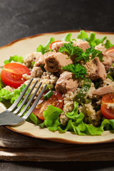 Tasty salad with couscous, tuna and vegetables