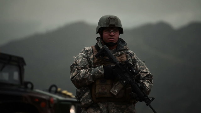 Portrait shot of soldier nodding.