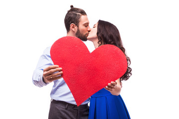 young happy smiling Couple  holding heart  on white background