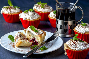 Muffin with cherry and pineapple on white plate