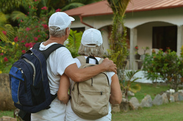 elderly couple rest at tropical resort