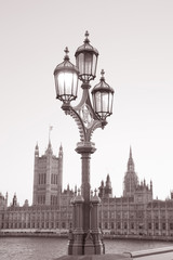 Fototapeta na wymiar Lamppost and the Houses of Parliament, London, England, UK in Black and White Sepia Tone